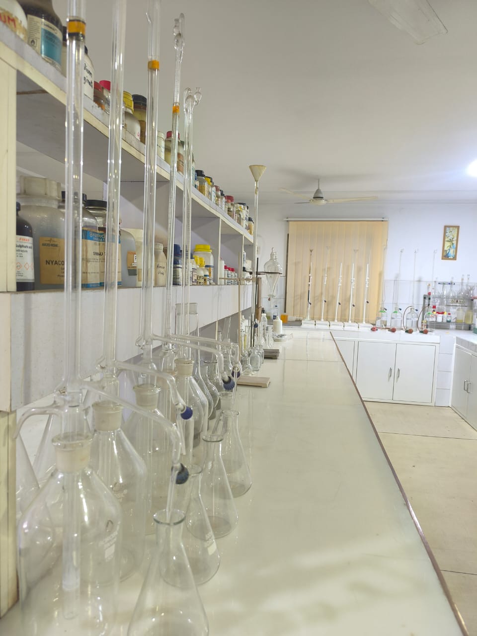 Burettes and analytical glassware in the lab